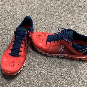 On running shoes orange and blue